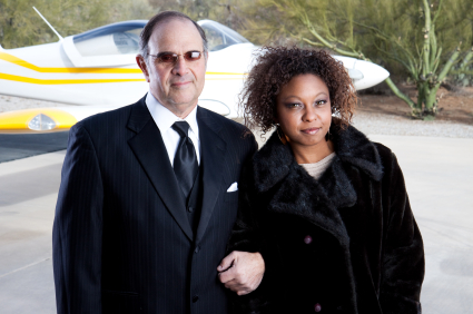 Rich couple arriving in style at the airport